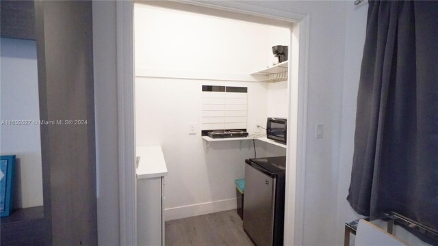 bathroom with vanity and wood-type flooring