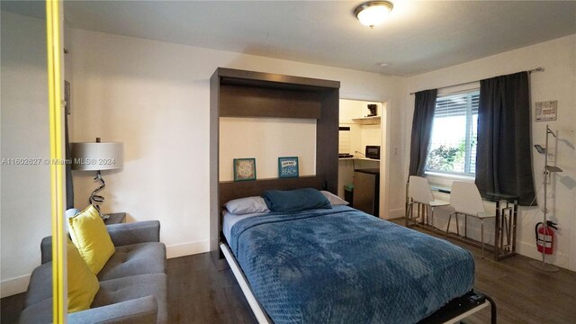 bedroom featuring dark hardwood / wood-style floors