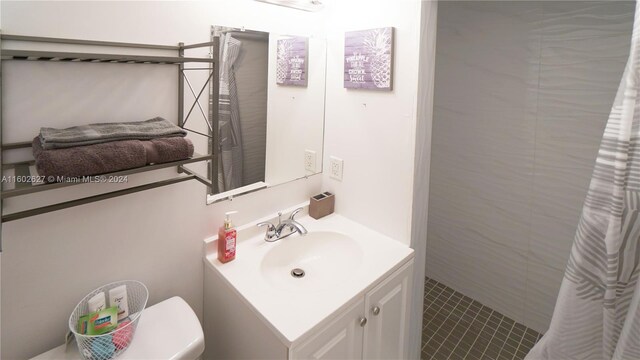 bathroom featuring vanity and toilet