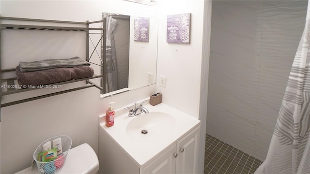 full bathroom featuring toilet and vanity