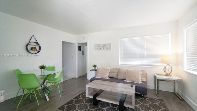 living room with dark wood-type flooring