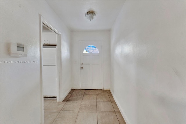 doorway to outside featuring light tile patterned floors