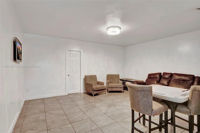 living room with light tile patterned flooring