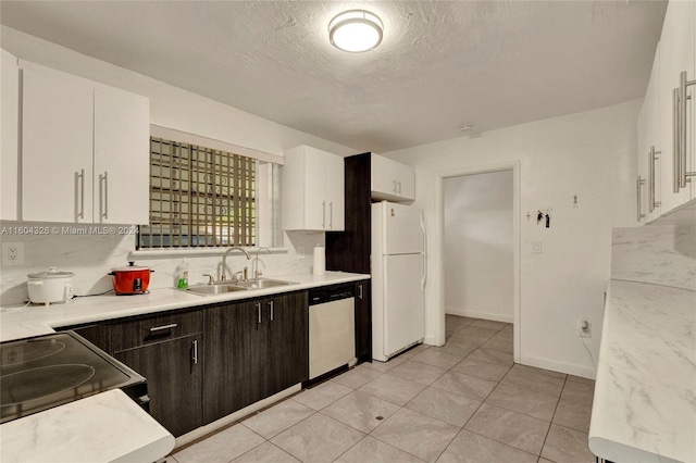 kitchen with dark brown cabinetry, dishwasher, and white cabinets