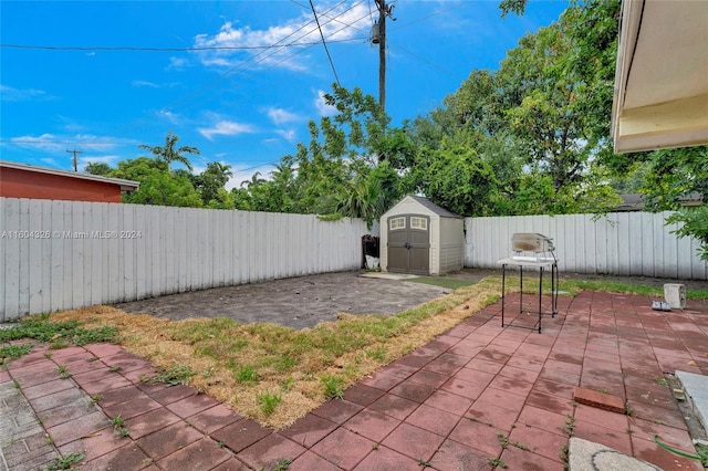 view of patio / terrace featuring a storage unit