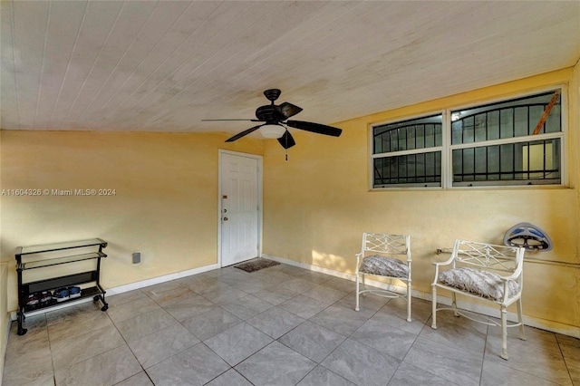 interior space with ceiling fan