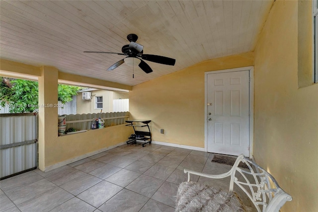 view of patio / terrace with an AC wall unit and ceiling fan