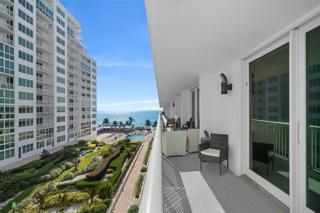 balcony featuring a water view