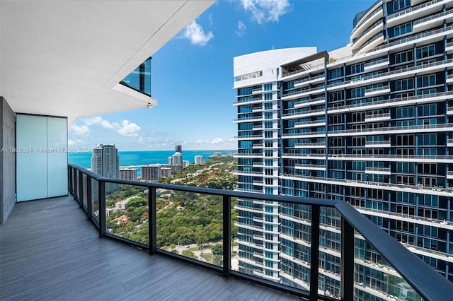 balcony featuring a water view