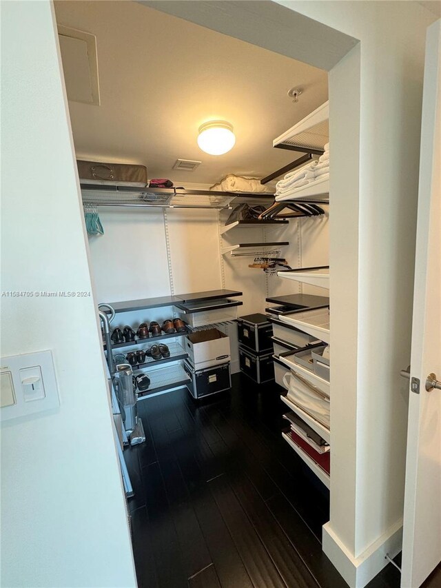 walk in closet featuring hardwood / wood-style flooring