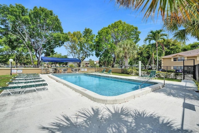 view of swimming pool featuring a patio area