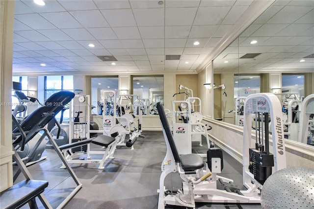 exercise room with a drop ceiling