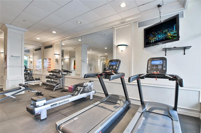 exercise room with a paneled ceiling