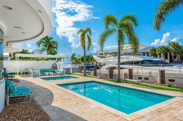 view of swimming pool featuring a patio