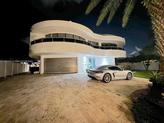 3344 NE 167th St, North Miami Beach, FL 33160 - view of front of property featuring decorative driveway and an attached garage