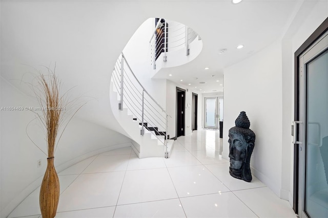 3344 NE 167th St, North Miami Beach, FL 33160 - foyer entrance featuring stairs, recessed lighting, light tile patterned flooring, and baseboards