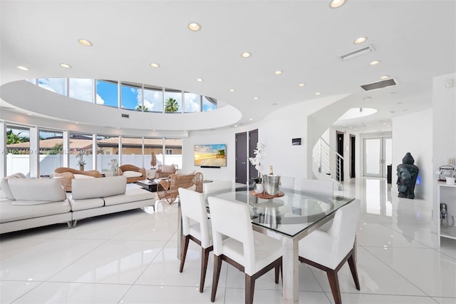 3344 NE 167th St, North Miami Beach, FL 33160 - dining space featuring recessed lighting, a towering ceiling, and light tile patterned floors