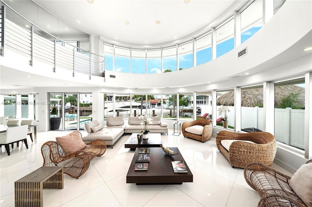 3344 NE 167th St, North Miami Beach, FL 33160 - tiled living area featuring a towering ceiling and recessed lighting