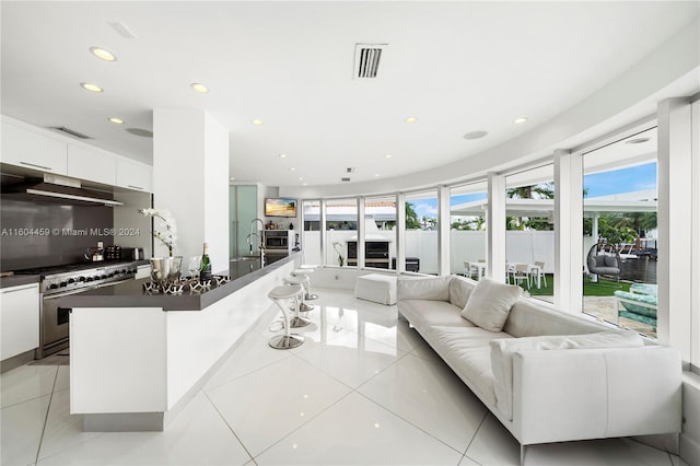 3344 NE 167th St, North Miami Beach, FL 33160 - living room featuring recessed lighting and light tile patterned flooring