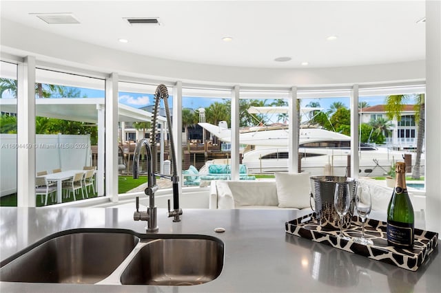 kitchen featuring plenty of natural light and sink