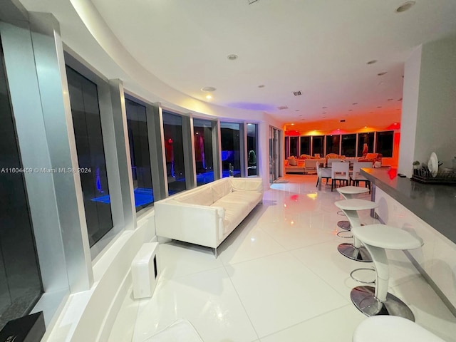 3344 NE 167th St, North Miami Beach, FL 33160 - living area featuring tile patterned flooring and recessed lighting