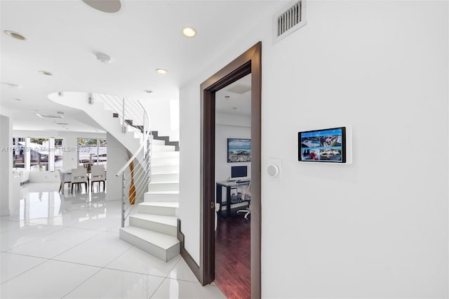 stairway with hardwood / wood-style flooring