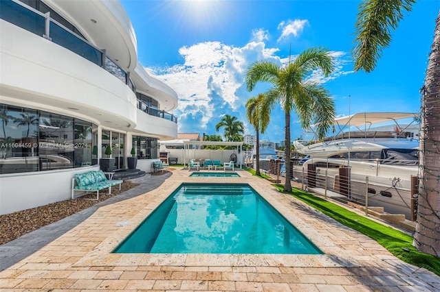 view of swimming pool with a patio