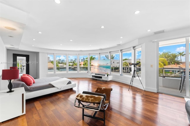 3344 NE 167th St, North Miami Beach, FL 33160 - bedroom with access to outside, wood finished floors, and recessed lighting