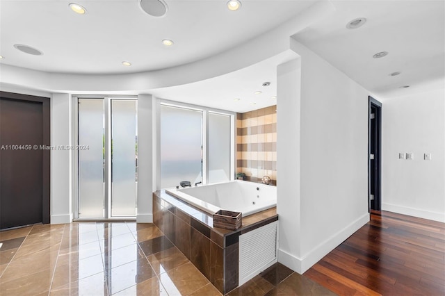 3344 NE 167th St, North Miami Beach, FL 33160 - bathroom featuring a jetted tub, a stall shower, recessed lighting, and baseboards