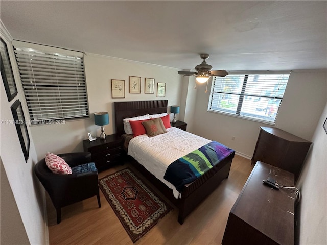 bedroom featuring ceiling fan and wood-type flooring