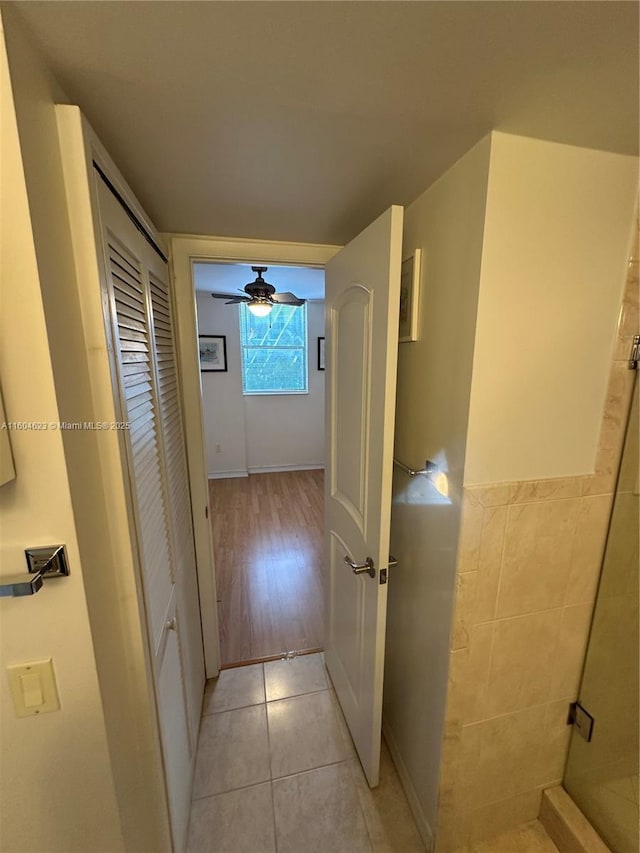 corridor with light tile patterned flooring