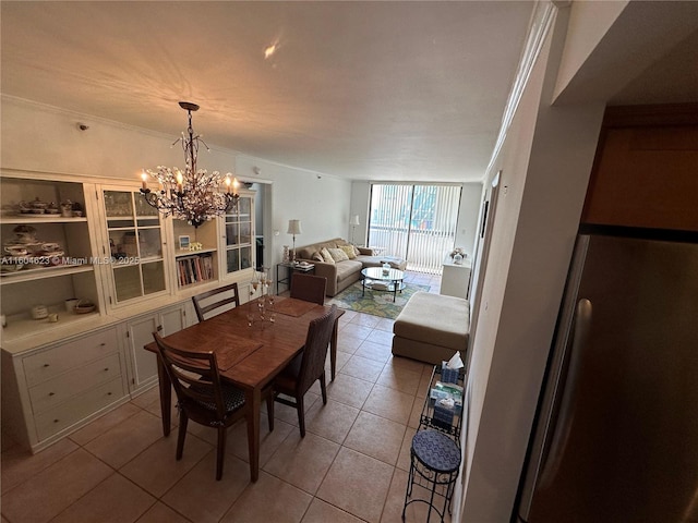 tiled dining space featuring an inviting chandelier