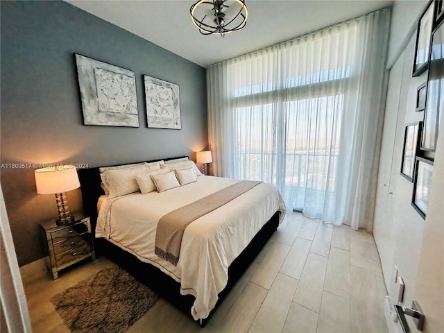 bedroom featuring light wood-type flooring and multiple windows