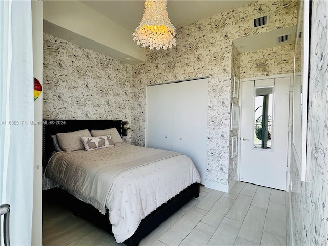 bedroom featuring a notable chandelier