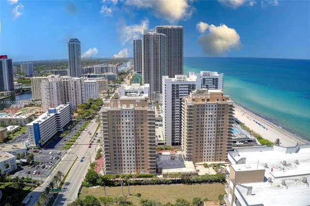 aerial view with a view of the beach and a water view