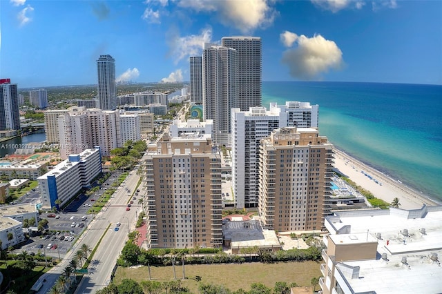 bird's eye view with a view of the beach, a water view, and a view of city