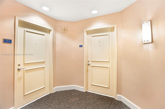 hallway featuring carpet