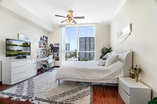 bedroom with ornamental molding, expansive windows, dark wood-style flooring, and ceiling fan