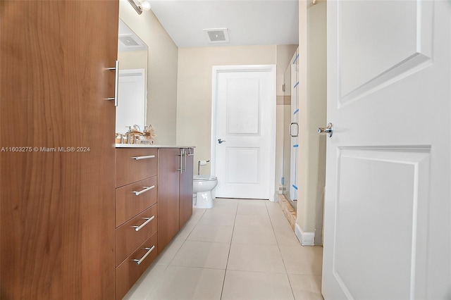 hallway with light tile patterned floors and visible vents