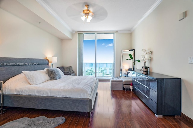 bedroom with dark wood finished floors, crown molding, a ceiling fan, a wall of windows, and access to outside