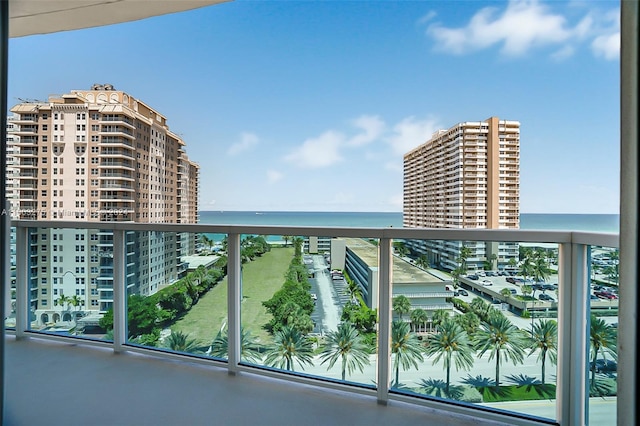 balcony featuring a view of city and a water view