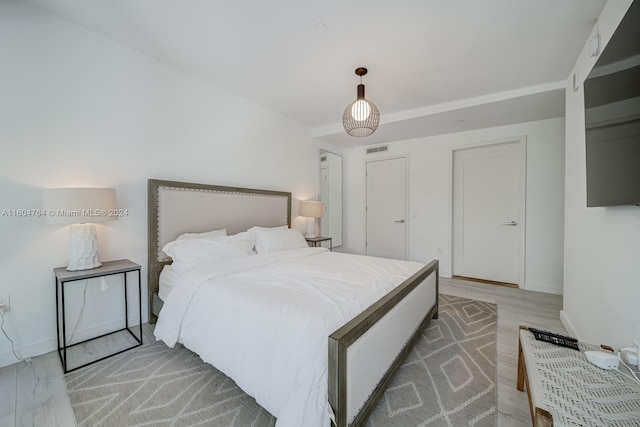 bedroom featuring wood-type flooring