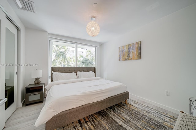 bedroom featuring a closet and light hardwood / wood-style floors