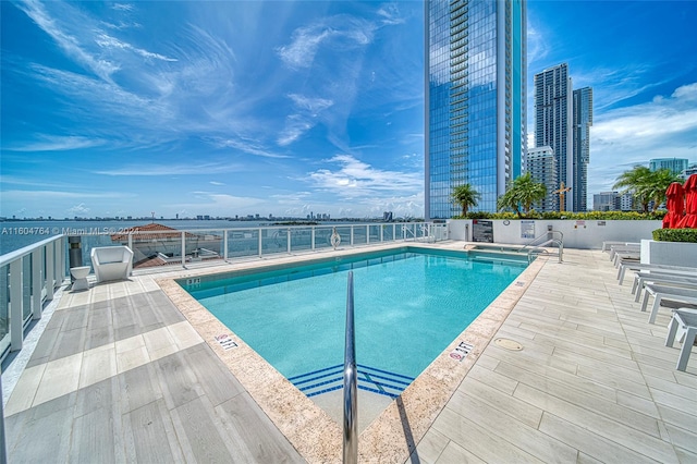 view of swimming pool featuring a patio