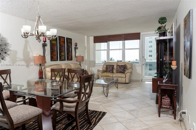 dining space featuring light tile patterned floors, a chandelier, and a textured ceiling