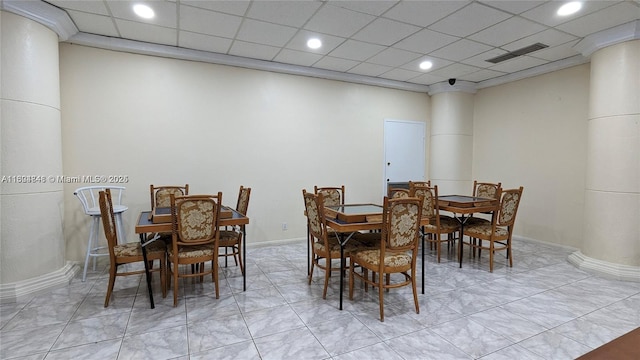 dining room with a paneled ceiling