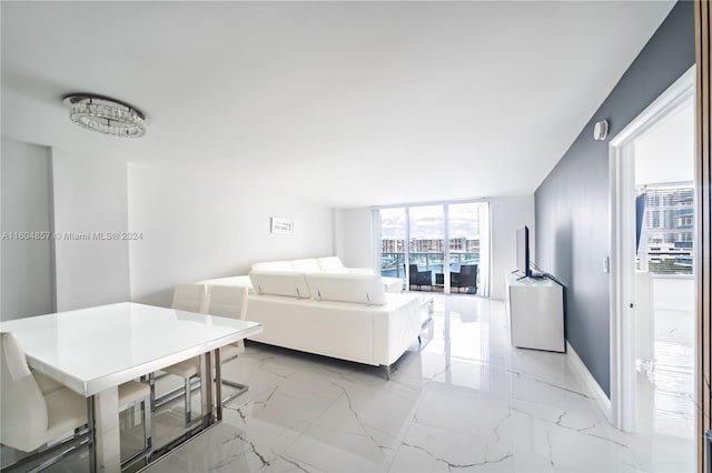 3800 S Ocean Dr Unit 803, Hollywood, FL 33019 - living area featuring baseboards, marble finish floor, and expansive windows