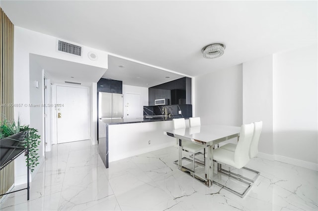 dining room featuring sink