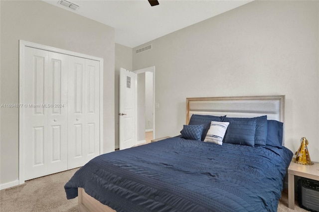 carpeted bedroom with a closet and ceiling fan