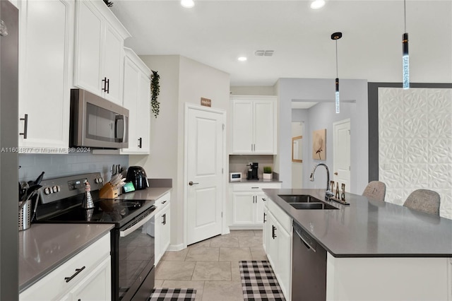 kitchen featuring light tile flooring, black electric range, dishwasher, hanging light fixtures, and sink